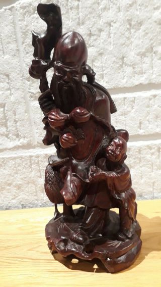 LARGE VINTAGE HAND CARVED CHINESE HOLY WOODEN FIGURE WITH BOY AND CRANE.  26.  5CM. 3