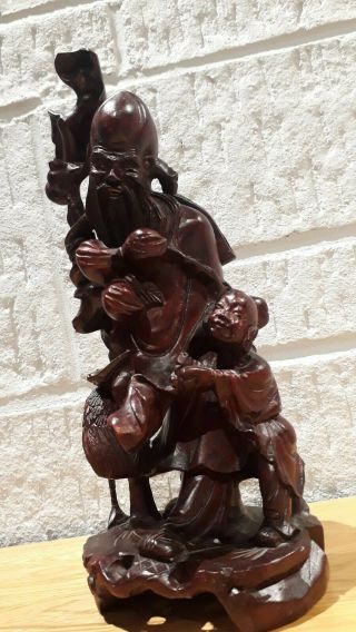 LARGE VINTAGE HAND CARVED CHINESE HOLY WOODEN FIGURE WITH BOY AND CRANE.  26.  5CM. 4