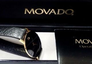 1990s Movado 87 - 40 - 882 Vintage Gold Black Mirror Finish Round Thin Mens Watch