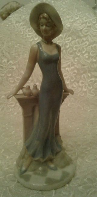 Porcelain Figurine Of A Young Woman With Birds