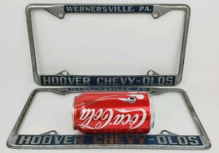 (2) Vintage Chevrolet Oldsmobile Hoover Car Dealer Metal License Plate Frames PA 2