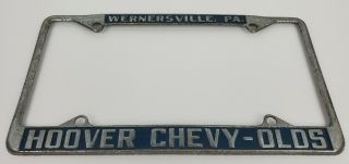 (2) Vintage Chevrolet Oldsmobile Hoover Car Dealer Metal License Plate Frames PA 4
