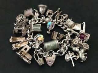 Vintage Sterling Silver Charm Bracelet With 25 Silver Charms.  140 Grams