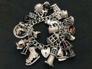 Vintage Sterling Silver Charm Bracelet With 22 Silver Charms.  143 Grams