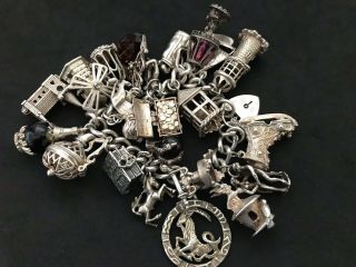 Vintage Sterling Silver Charm Bracelet with 22 Silver Charms.  143 grams 4