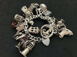 Vintage Sterling Silver Charm Bracelet with 22 Silver Charms.  143 grams 5