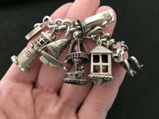 Vintage Sterling Silver Charm Bracelet with 22 Silver Charms.  143 grams 7