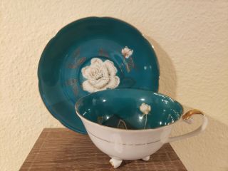 Unmarked Teal/aqua Blue And White Rose Footed Tea Cup And Saucer