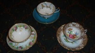 3 Tea Cups & Saucers.  2 W/matching Saucers And 1 Cup W/ A Color Matching Saucer