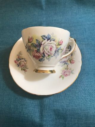 Vintage Delphine Bone China Tea Cup & Saucer White W/ Blue & Hint Of Pink Roses