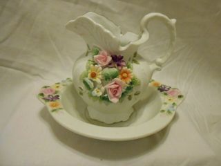 Vintage Ceramic Pitcher And Bowl With Delicately Sculpted Flowers.