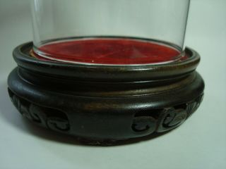 AN ANTIQUE CHINESE CARVED WOOD STAND WITH GLASS DOME. 5