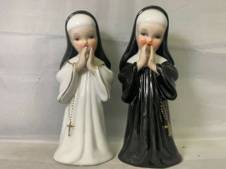 Porcelain Nun Figurines L & M,  1956