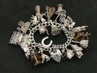 Vintage Sterling Silver Charm Bracelet With 23 Silver Charms.  140 Grams
