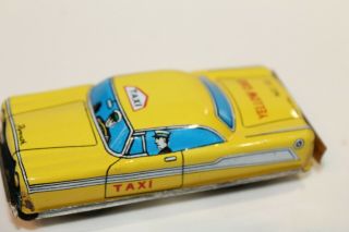 Vintage Tin Litho Friction Powered Plymouth Yellow Taxi Cab