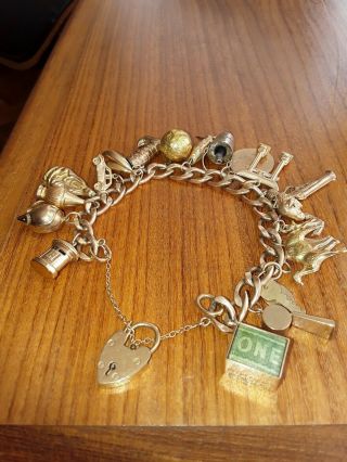 Vintage 9ct Gold Charm Bracelet With 20 Charms And Padlock Fastening.
