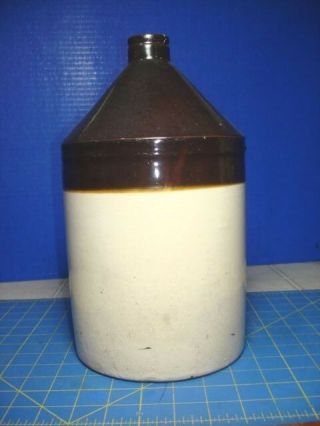 1 GALLON BROWN AND BEIGE STONEWARE JUG AND DISPLAY 4