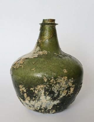 An Extremely Rare And Early Shaft And Globe English Wine Bottle,  1660 - 1670.