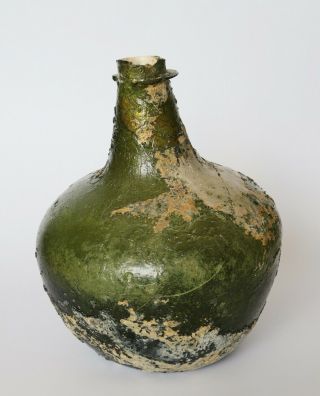An Extremely rare and early SHAFT AND GLOBE ENGLISH WINE BOTTLE,  1660 - 1670. 2
