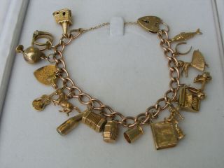 A Vintage 9ct Gold Charm Bracelet With 18 Charms 42.  4 Gm