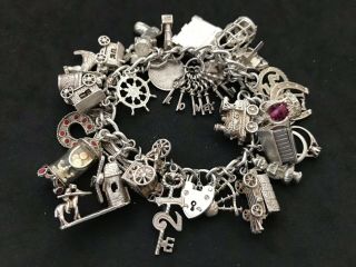 Vintage Sterling Silver Charm Bracelet With 33 Silver Charms.  103 Grams