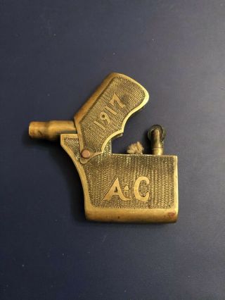 Antique trench WWI cigarette lighter,  Brass.  Shape of the pistol 3