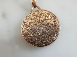 A 9 CT ROSE GOLD ANTIQUE FOLIATE ENGRAVED LOCKET 7