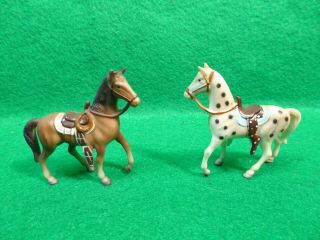 Two Mini Hard Plastic Western Saddle Horses