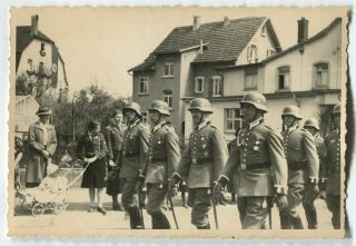 German Wwii Archive Photo: Wehrmacht Soldiers In Helmets Marching On The Street