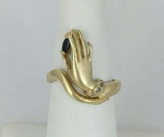 Stylized Ladies Hand Ring Holding Sapphire And Wearing Diamond Bracelet 14k Gold