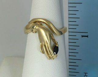 Stylized Ladies Hand Ring Holding Sapphire and Wearing Diamond Bracelet 14K Gold 5