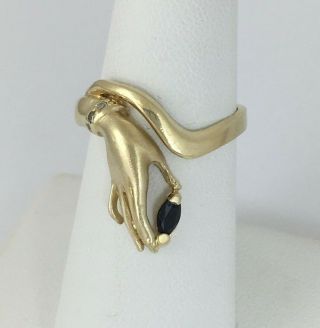 Stylized Ladies Hand Ring Holding Sapphire and Wearing Diamond Bracelet 14K Gold 6