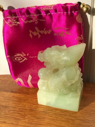 Chinese Hand Carved Pale Green Jade Dragon Statue And Ornate Bag