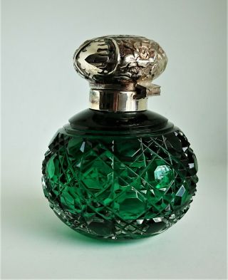 silver topped perfume bottle,  Birmingham 2001,  green cut glass,  with stopper. 2