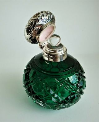 silver topped perfume bottle,  Birmingham 2001,  green cut glass,  with stopper. 3