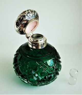 silver topped perfume bottle,  Birmingham 2001,  green cut glass,  with stopper. 4