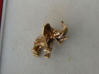 VERY RARE 9ct.  GOLD VINTAGE SOLID ELEPHANT WITH TRUNK UP CHARM OR PENDANT 5.  8grms 2
