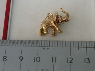 VERY RARE 9ct.  GOLD VINTAGE SOLID ELEPHANT WITH TRUNK UP CHARM OR PENDANT 5.  8grms 4