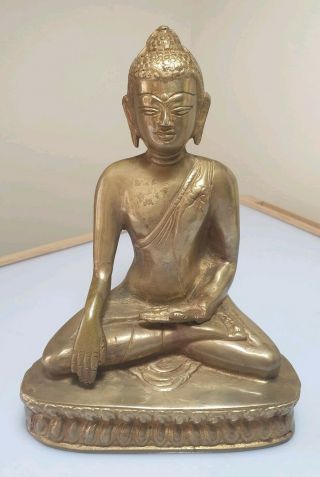 A Qing Dynasty Tibetan Gilt Bronze Figure Of Buddha.