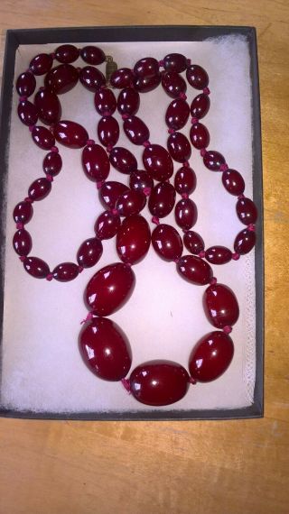 Vintage Cherry Bakelite Graduated And Knotted Oval Bead Necklace