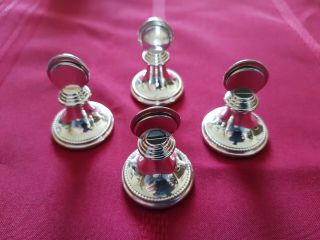 A Vintage Set Of Four Solid Silver Menu Holders