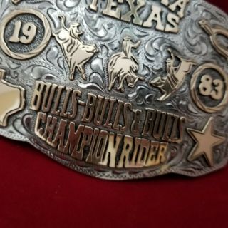 RODEO BUCKLE VINTAGE 1983 NOCONA TEXAS BULL RIDING CHAMP.  SIGNED Engraved 747 3