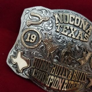 RODEO BUCKLE VINTAGE 1983 NOCONA TEXAS BULL RIDING CHAMP.  SIGNED Engraved 747 4
