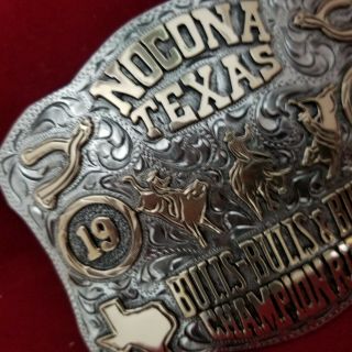 RODEO BUCKLE VINTAGE 1983 NOCONA TEXAS BULL RIDING CHAMP.  SIGNED Engraved 747 5
