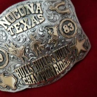 RODEO BUCKLE VINTAGE 1983 NOCONA TEXAS BULL RIDING CHAMP.  SIGNED Engraved 747 6
