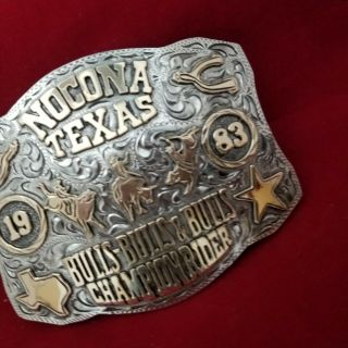 RODEO BUCKLE VINTAGE 1983 NOCONA TEXAS BULL RIDING CHAMP.  SIGNED Engraved 747 7