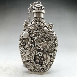 Ancient Tibetan silver snuff bottles are carved by hand with dragon designs 2