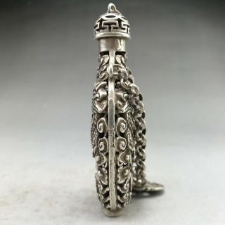 Ancient Tibetan silver snuff bottles are carved by hand with dragon designs 3