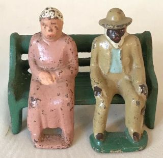 Vintage 2” Lead Man & Woman Figures Sitting On Bench,  Unmarked