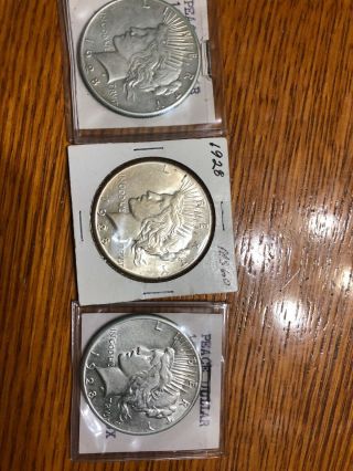 Three (3) Here’s 3 Rare 1928 P Peace Silver Dollar Raw Kay Date